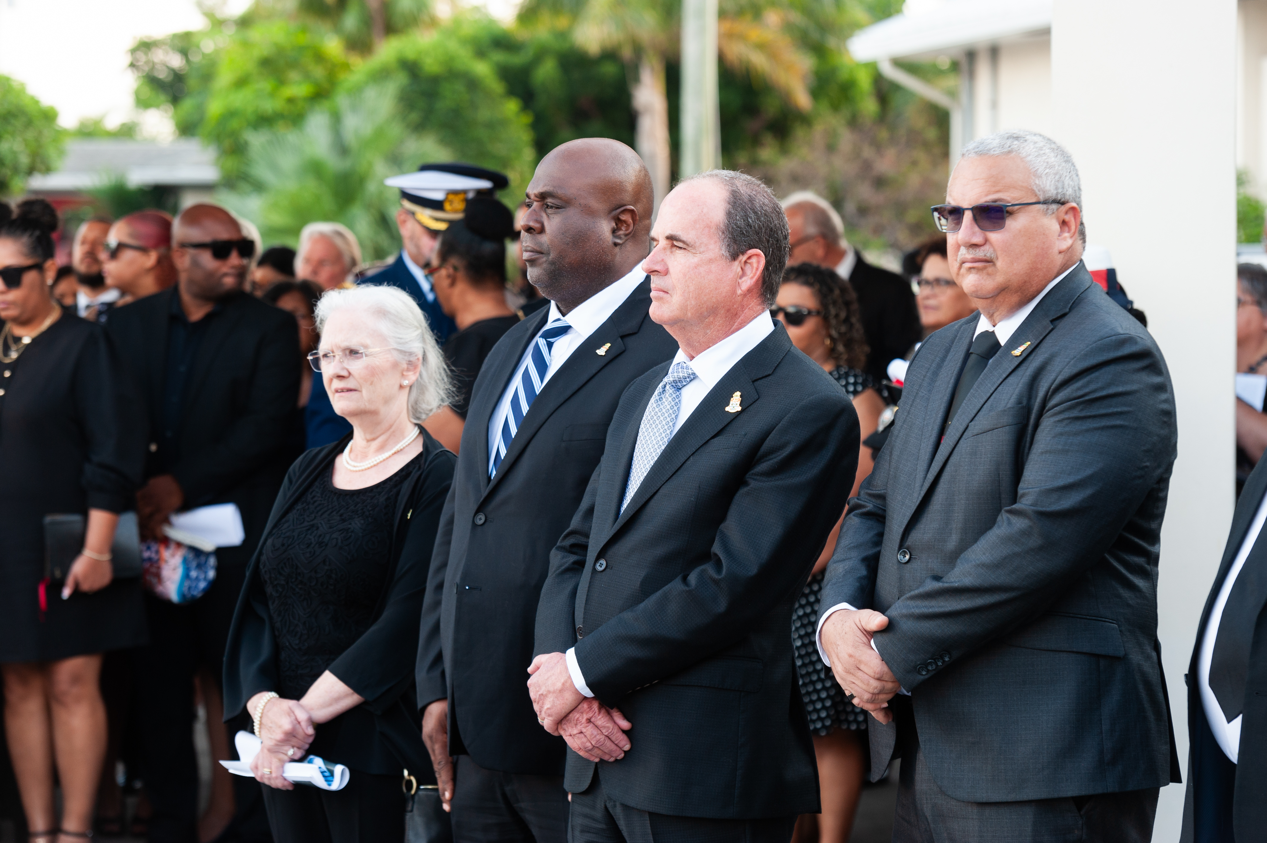 Her Excellency Governor Jane Owen, Minister for Caymanian Employment and Immigration Hon Michael Myles, Acting Premier Hon. Gary Rutty and Deputy Governor Hon. Franz Manderson stand in observance for the last post and ceremonial gun salute.