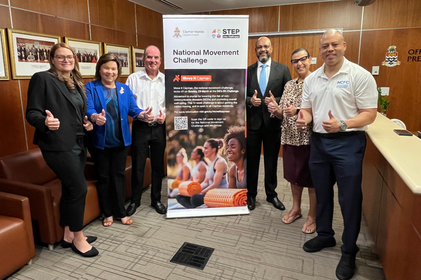NCFC government Hon. Katherine Ebanks-Wilks, Ms. Heather Bodden, Hon. Gary Rutty, Hon. Isaac Rankine, Ms. Julie Hunter, and Hon. André Ebanks with thumbs up promoting the Move it Cayman challenge. .png